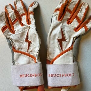 Bruce Bolt White and Orange Batting Gloves